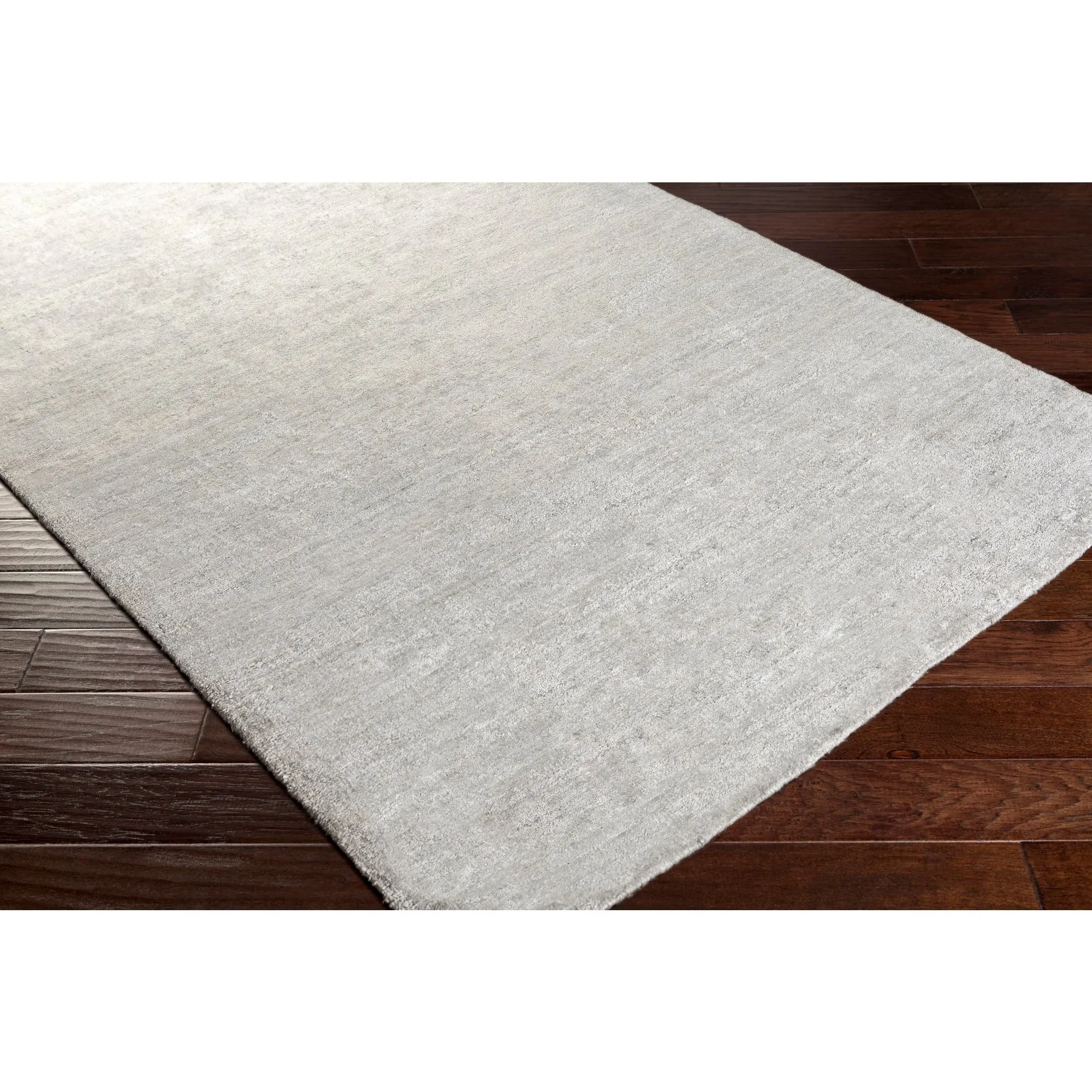 Hand-woven Dan Solid Viscose Area Rug