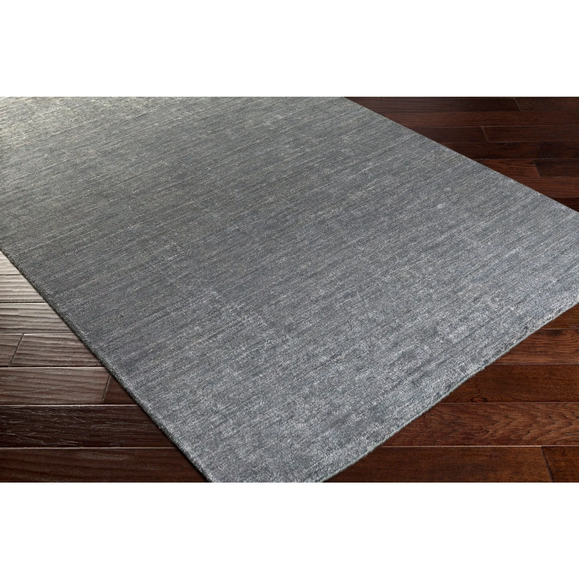 Hand-woven Dan Solid Viscose Area Rug