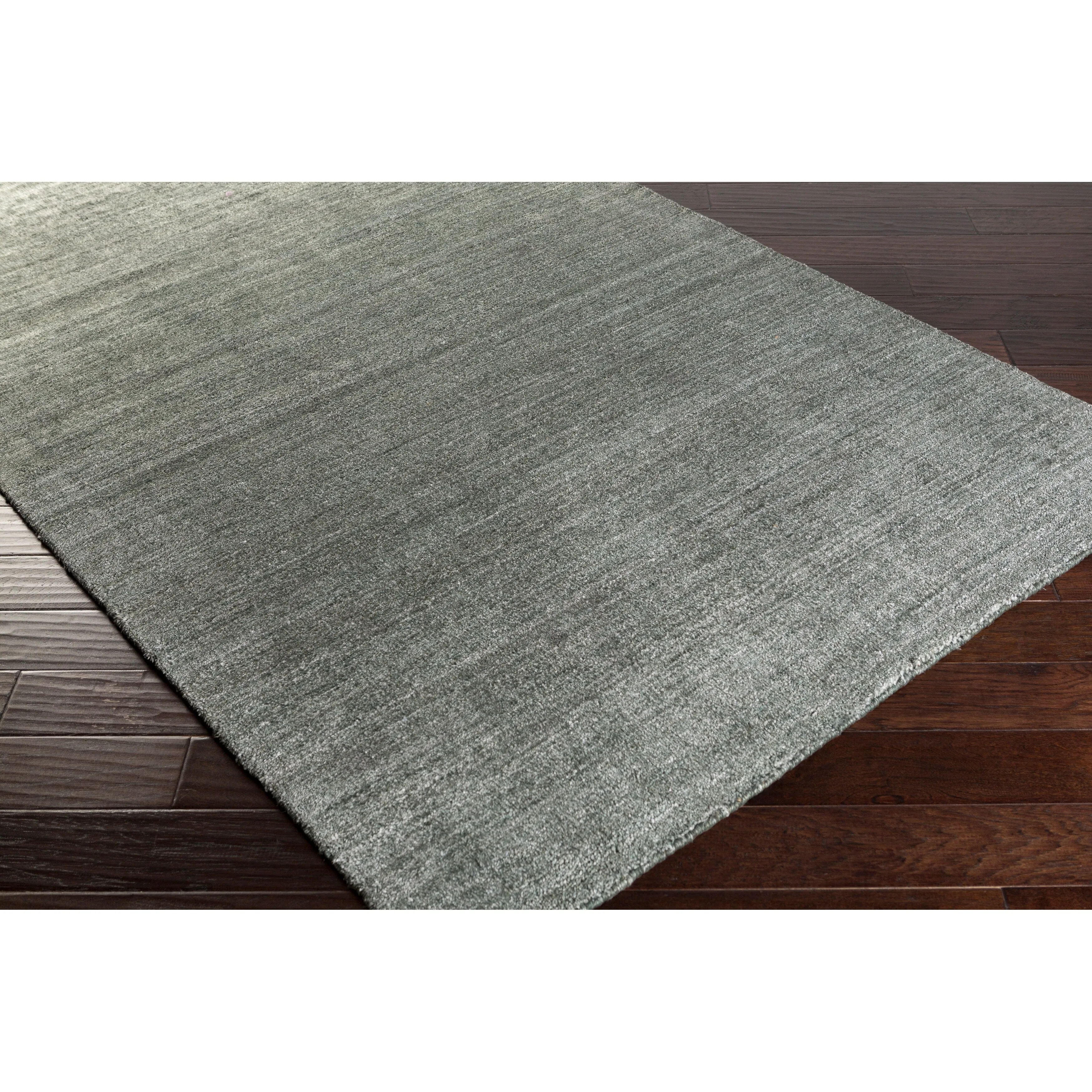 Hand-woven Dan Solid Viscose Area Rug