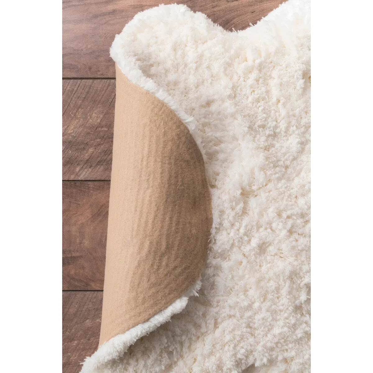 Nuloom Handmade Faux Sheepskin Shag Rug - 2' x 4'5